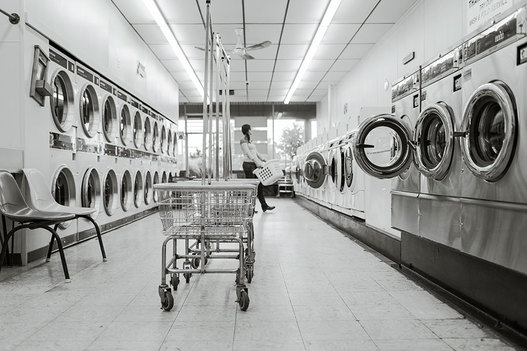 Interior of Laundromat with customer 